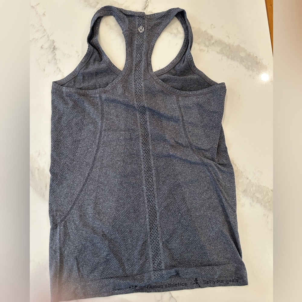 Dark great. Lululemon razorback tank top. Size 4.